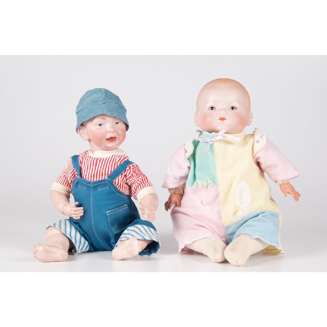 Kammer and Reinhardt,/i> "Kaiser Baby" and Armand: Continental. A Kammer and Reinhardt "Kaiser Baby," no 36, with jointed body and open mouth, back of head marked KR, 36 with a Jewish star, and an Armand Marseille "Dream Baby" with jointed body