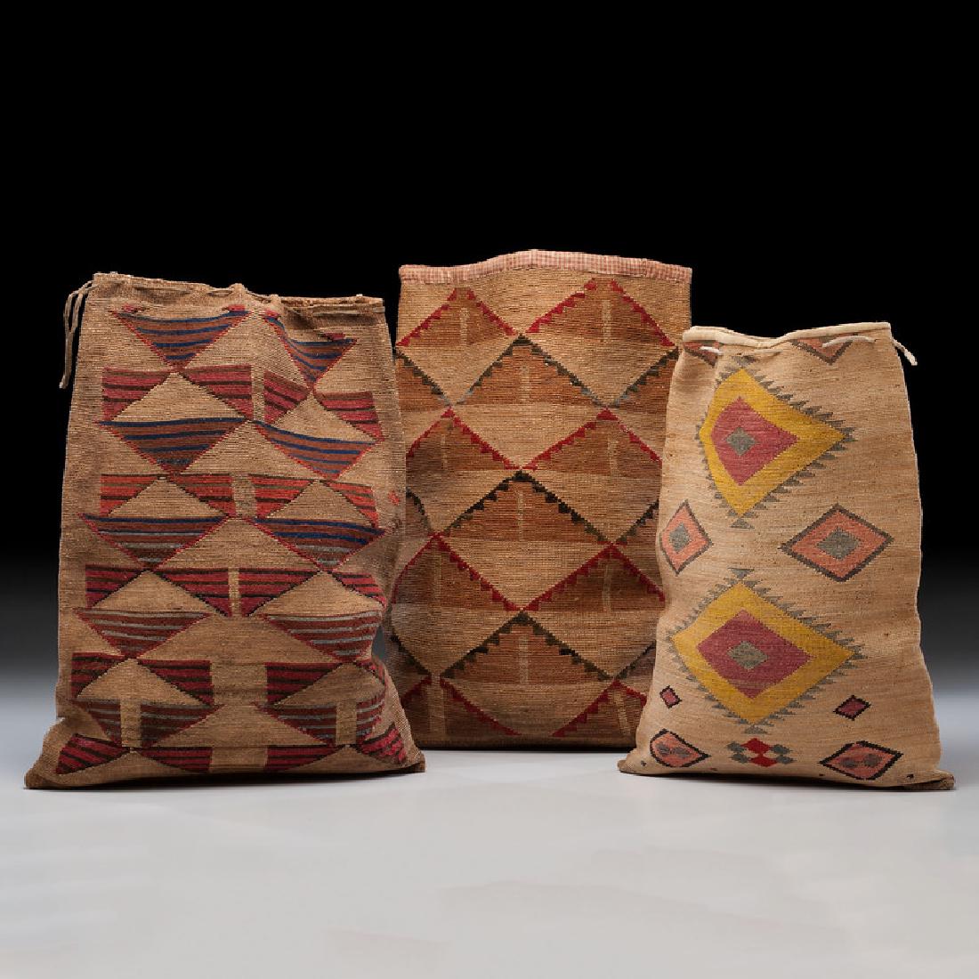 Nez Perce Corn Husk Flat Bags, From the Collection of: lot of 3 bags with graphic designs, including one with large, nesting diamonds; opposite with five rows of chevrons, 19 x 14.25 in.; PLUS another with finely woven bag with blue, red, and brown styl