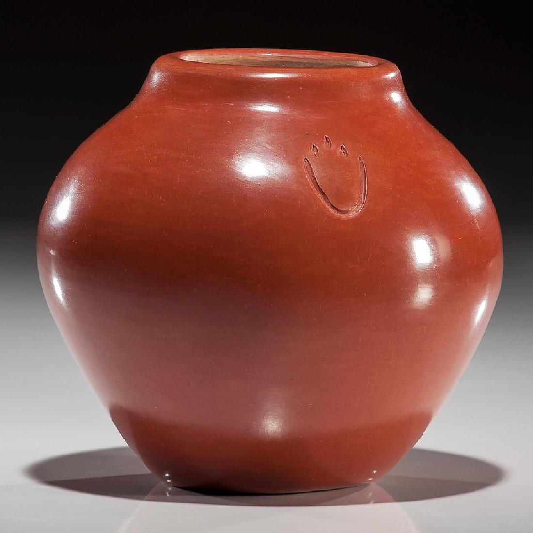 Jason Ebelacker (Santa Clara, b.1980) Redware Pottery: of a bulbous shape, embellished with two bear paws; signed on base; height 5.757 in. x diameter 5.5 in.ca 2000