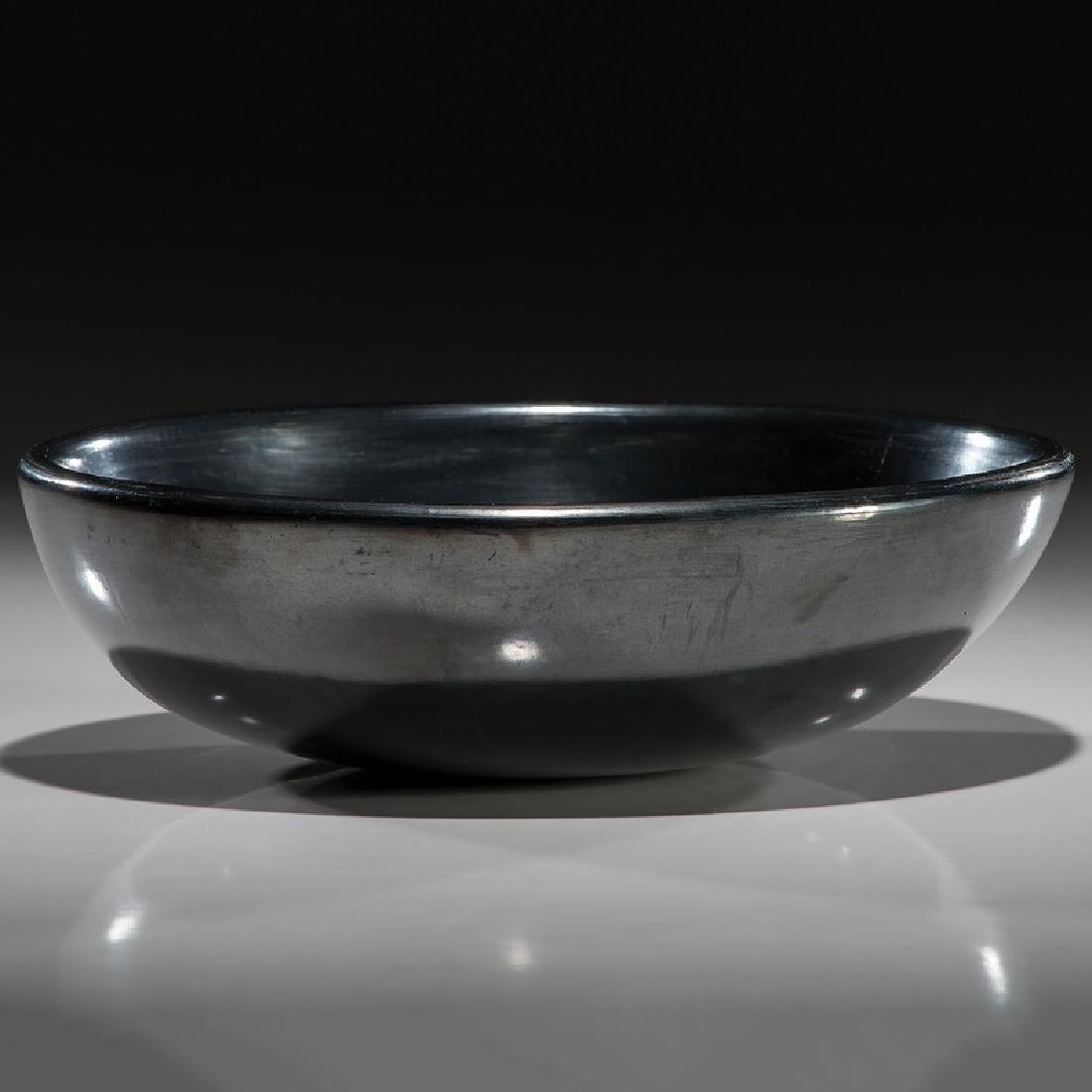 Santana and Adam Martinez (San Ildefonso, 1909-2002 /: elegantly formed, undecorated bowl; signed on base, height 3 in. x diameter 10 in.1943-1954Includes a Second Place ribbon from the New Mexico State Fair, 1965.