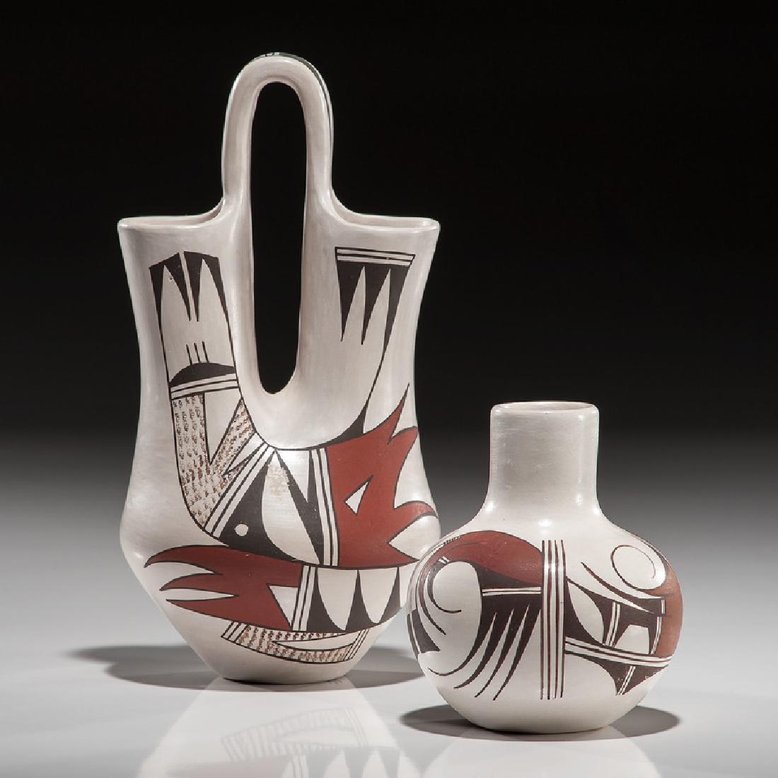 Joy and Marianne Navasie (Hopi, 1919-2012/ b. 1951): lot of 2, includes a wedding vase by Joy Navasie; hallmarked on base, height 8.25 in. x diameter 4.25 in.; AND a vase by Marianne Navasie; hallmarked on base, height 4.25 in. x diameter 3.5 in.second