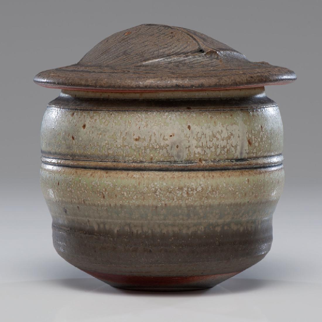 Karen Karnes (American, 1925-2016): Lidded Vessel wood-fired stoneware artist incised KK stamp on base ht. 6.5, dia. 6.5 in. This Karnes vessel has a combed glaze decoration on the lid.
