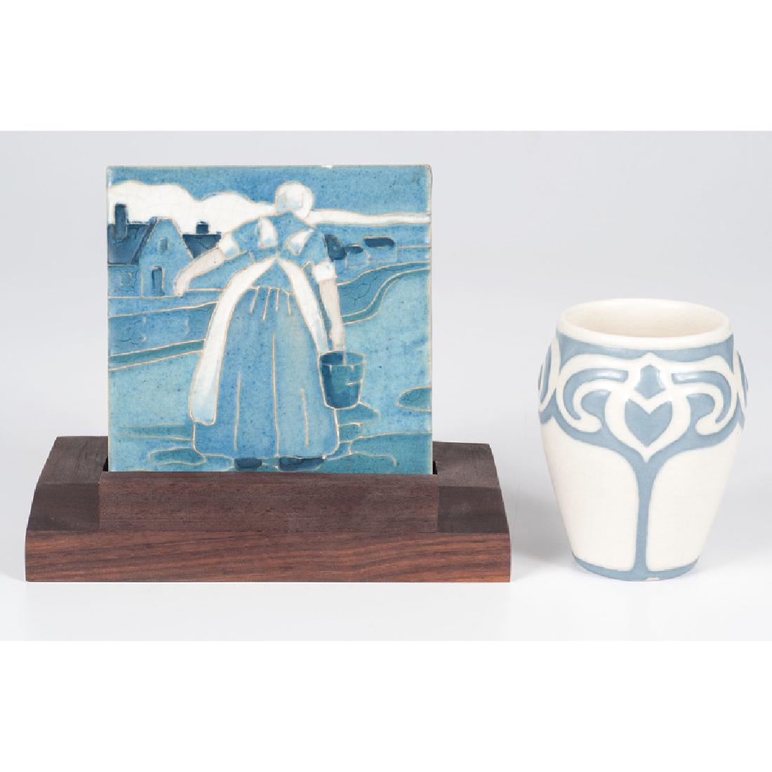 Rookwood Vellum Vase and Trivet: American (Cincinnati), 20th century. A Rookwood molded vellum vase by Sara Sax, 1916 with second mark, and a Dutch scene trivet, also marked for Rookwood, and with custom wooden stand; vase ht. 4.75,
