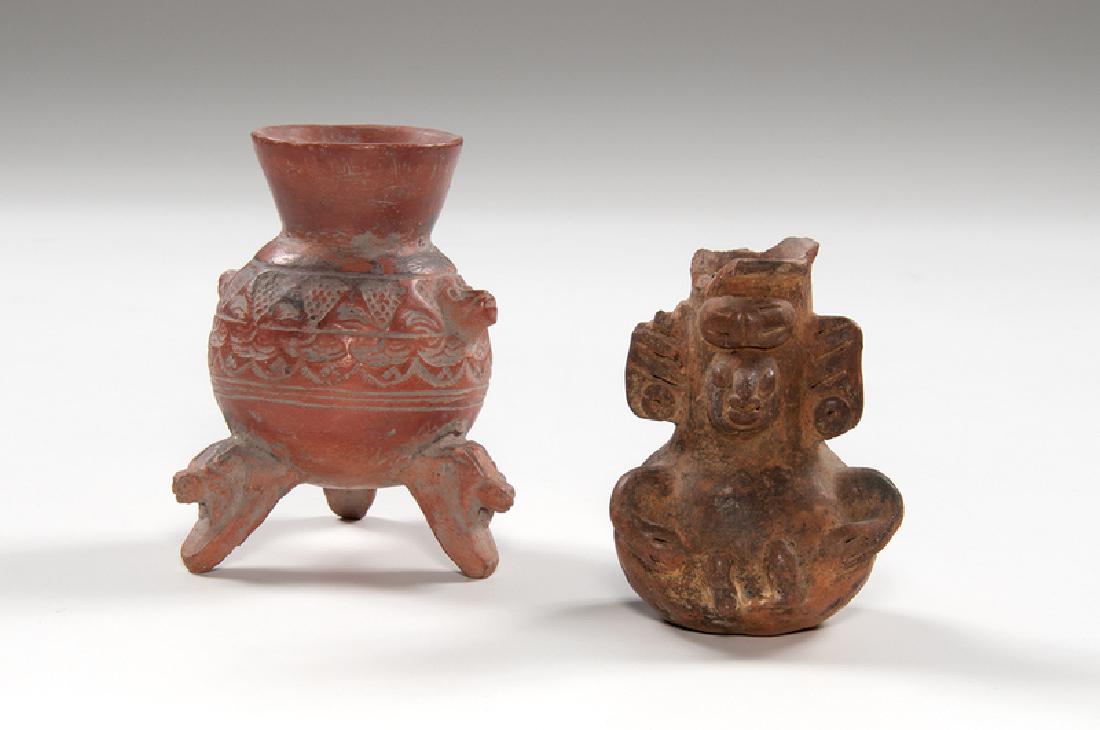 Pre-Columbian Pottery Vases: Pre-Columbian. A group of two pottery vases, including one anthropomorphic vase in pear shape with protruding arms and legs, and one redware vase in bulbous form with three alligator head feet; redwar