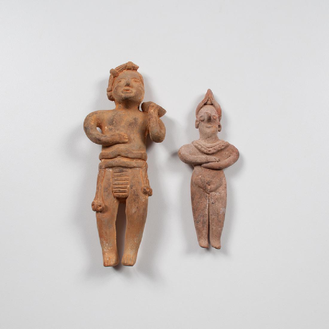 Colima Pottery Standing Figures: Mexico, Colima, pre-Columbian. A group of two pottery standing figures, including one male holding offering bowl on his shoulder, and one female fertility figure with arms folded; male (larger) ht. 7,