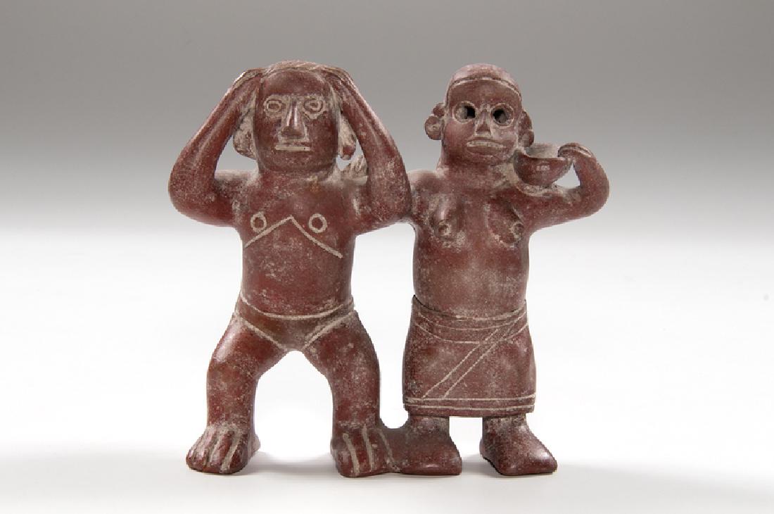 Redware Pottery Double Figure, Likely Nayarit or Colima: Mexico, Nayarit or Colima, pre-Columbian. A redware pottery figure depicting a joined male and female, each supporting a jar or bowl; ht. 8, wd. 9, dp. 5 in. Provenance: Collection of Ruth Begun