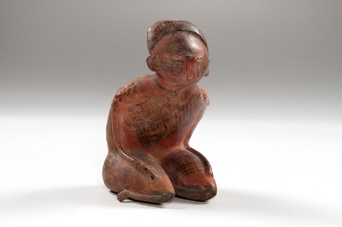 Nayarit Chinesco Redware Kneeling Figure: Mexico, Nayarit, pre-Columbian. A Chinesco redware kneeling figure, decorated with black cross-hatching; ht. 10, wd. 5.25, dp. 6 in. Provenance: Collection of Ruth Begun