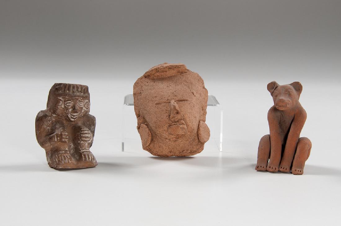 Pre-Columbian Pottery Figures, Plus: Pre-Columbian. A group of two pottery figures, including a head with applied and incised features, and a seated gray effigy figure; plus, a pre-Columbian style redware pottery seated bear or dog; head