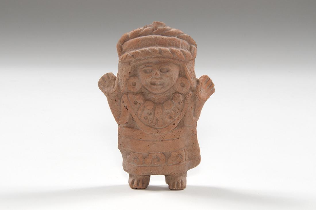 Mayan Pottery Whistle: Mexico, pre-Columbian. A Mayan pottery whistle and rattle, depicting a standing priest with ornate headdress and decorated apron; ht. 7, wd. 5, dp. 2 in. Provenance: Collection of Ruth Begun