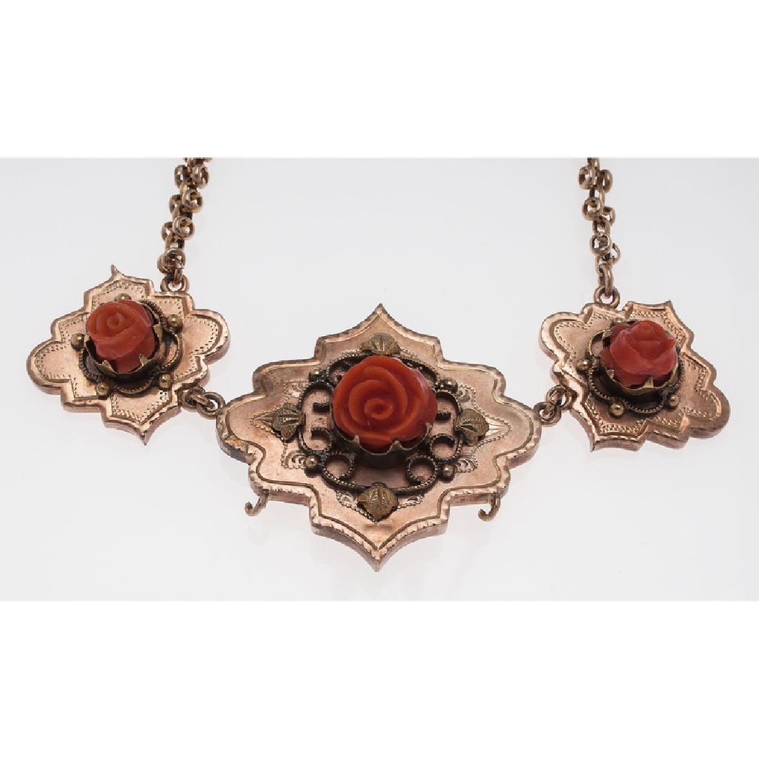 Gold Filled Victorian Coral Necklace: Comprised of panther style chain and three gold filled stampings set with carved coral roses measuring 7mm - 9mm. 18.5" long. Provenance: A Private Collection, Cincinnati, Ohio