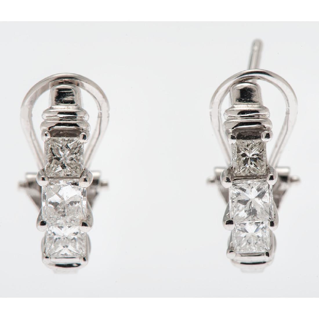 14 Karat White Gold Diamond Earrings: Containing six princess cut diamonds weighing approximately 1.0 carat total. Omega backs, 0.625" long, 2.7 dwt.
