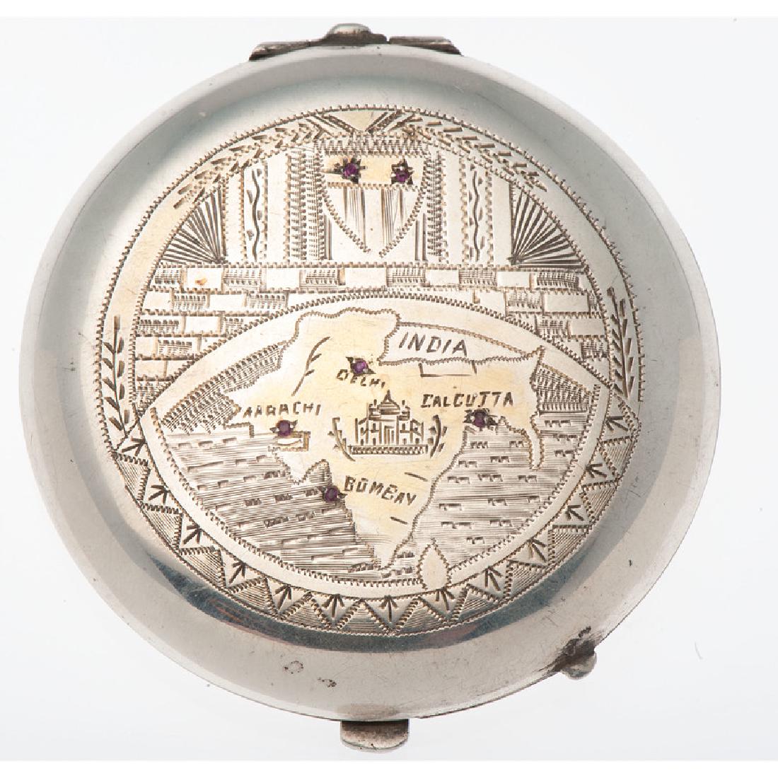 Souvenir Compact with Rubies: Top of case shows a map of India decorated with six rubies. Marked Windsor 26 Silver. 2.75" L x 2.75" W. 59.5 dwt.