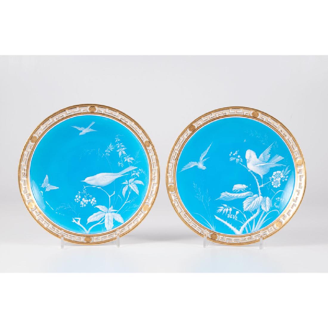 Mintons Porcelain Bird Plates: English, 19th century. A pair of Mintons cabinet plates with enamel and gilt decoration and pierced border, one plate with Minton's mark to underside; dia. 9.5 in. (each).