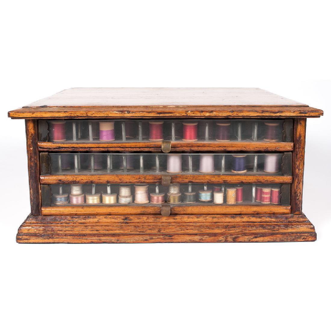 Richardson's Silk Spool Chest: American. An oak spool cabinet with three drawers, labeled on each side; ht. 8.5, wd. 19.25, dp. 18 in.