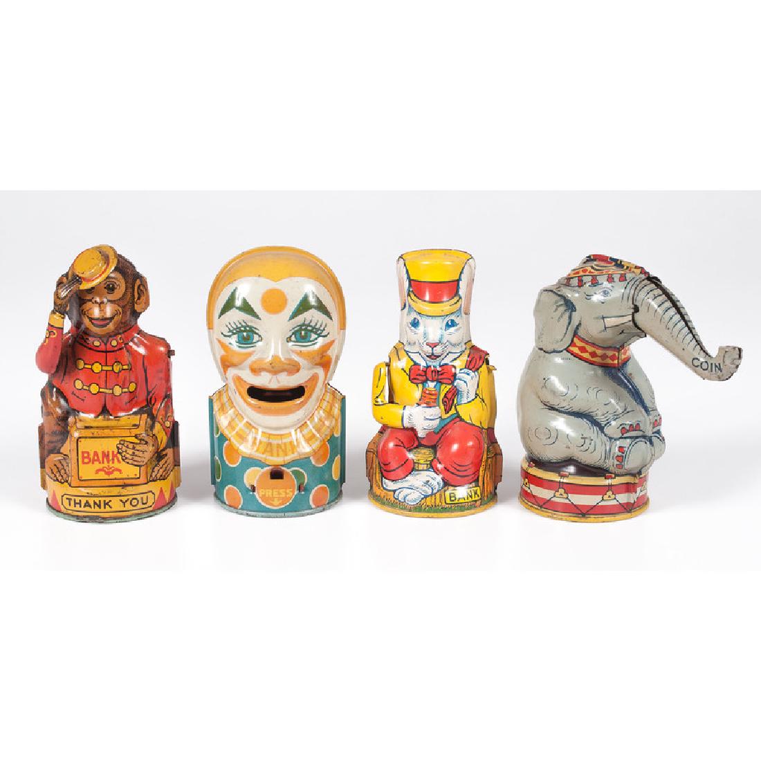 J. Chein Chromolithograph Tin Banks: 20th century. Four mechanical tin lithographed banks in the form of a monkey, clown, rabbit and elephant by J. Chein; elephant ht. 5.25, lg. 5.5, wd. 2.5 in.