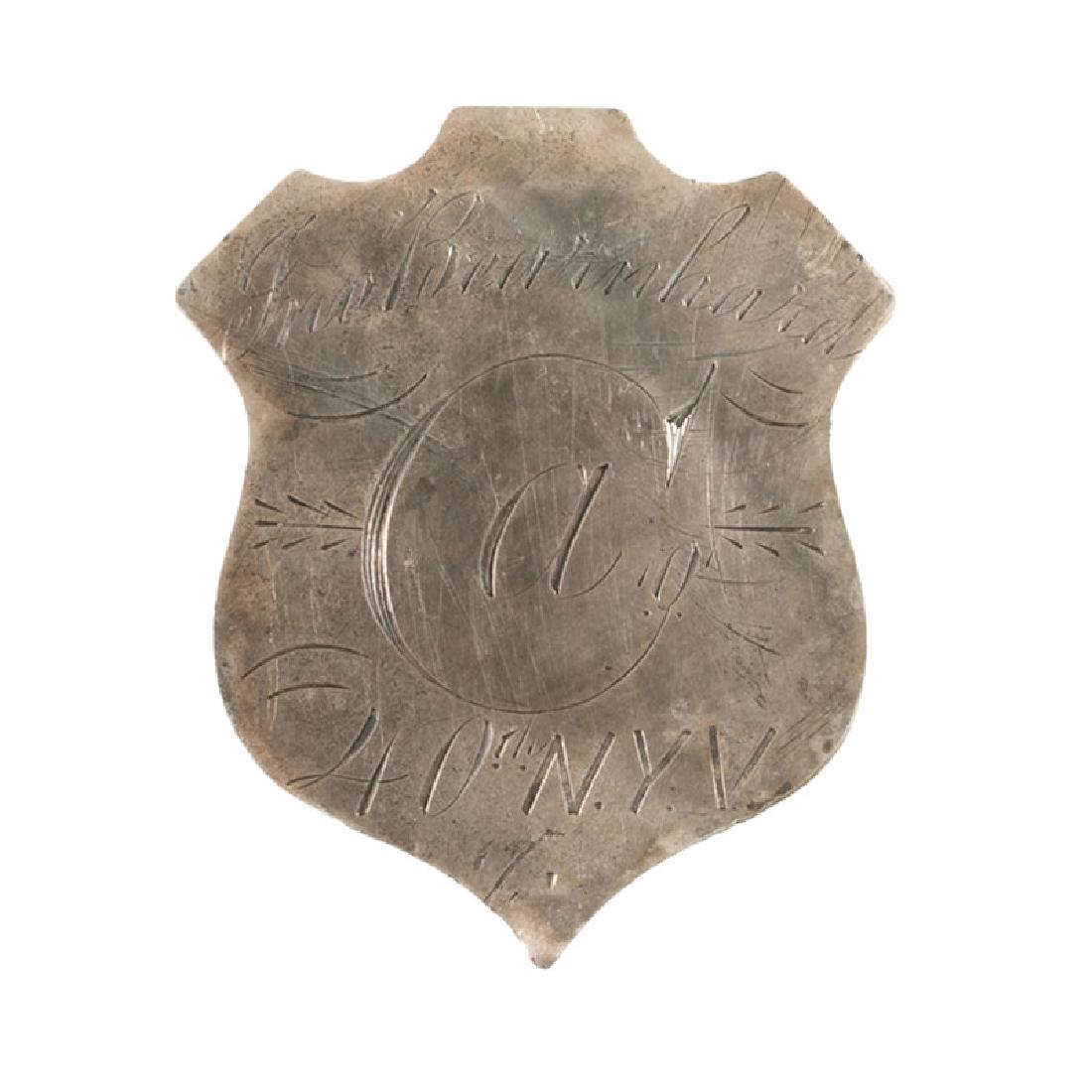 40th New York "Mozart Regiment" ID Pin: Silver shield-form identification pin, 1 x 1.25 in., engraved, "Jno. Bearnhard / Co. A / 40th N.Y.V." This pin probably belonged to John Bernhardt of Company A, 40th New York Infantry. He enlisted i