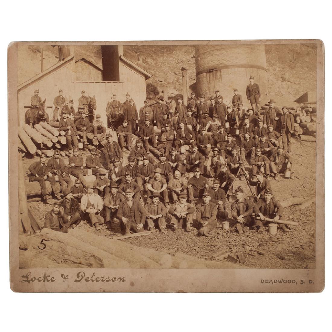 Cambria, Wyoming Miners, Imperial Photograph by Locke &: Albumen photograph, 7 x 9.5 in., on 8 x 10 in. mount with imprint of "Locke & Peterson, Deadwood, S.D." An untitled view showing a group of at least 75 miners, from young boys to adult men, including 
