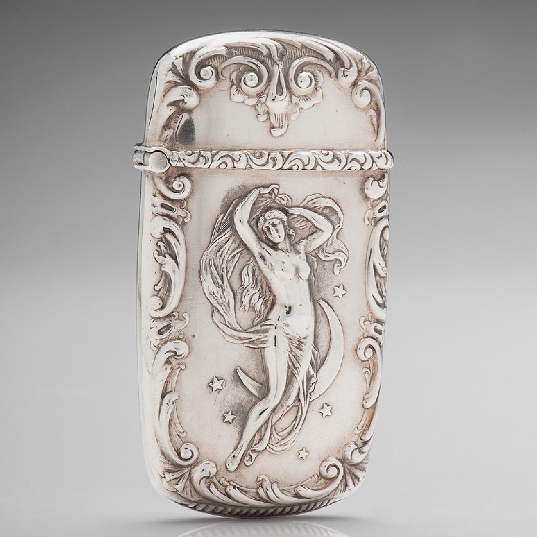 Sterling Match Safe with Nude in Crescent Moon: American, late 19th-early 20th century. A sterling match safe with repousse design on front and monogrammed on reverse; marked sterling on interior; ht. 2 1/2. wd. 1 3/8 in.