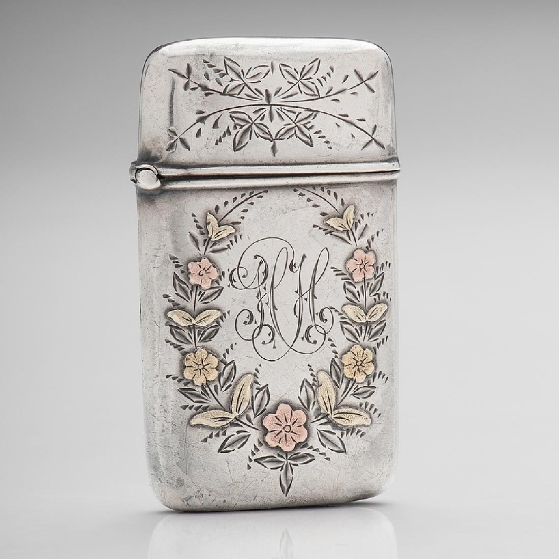 Match Safe Rose and Yellow Gold Flowers: American, late 19th-early 20th century. A silver match safe with rose and yellow gold inlay of a garland of flowers encircling a monogram, unmarked; ht. 2 1/2, wd. 1 1/2 in.