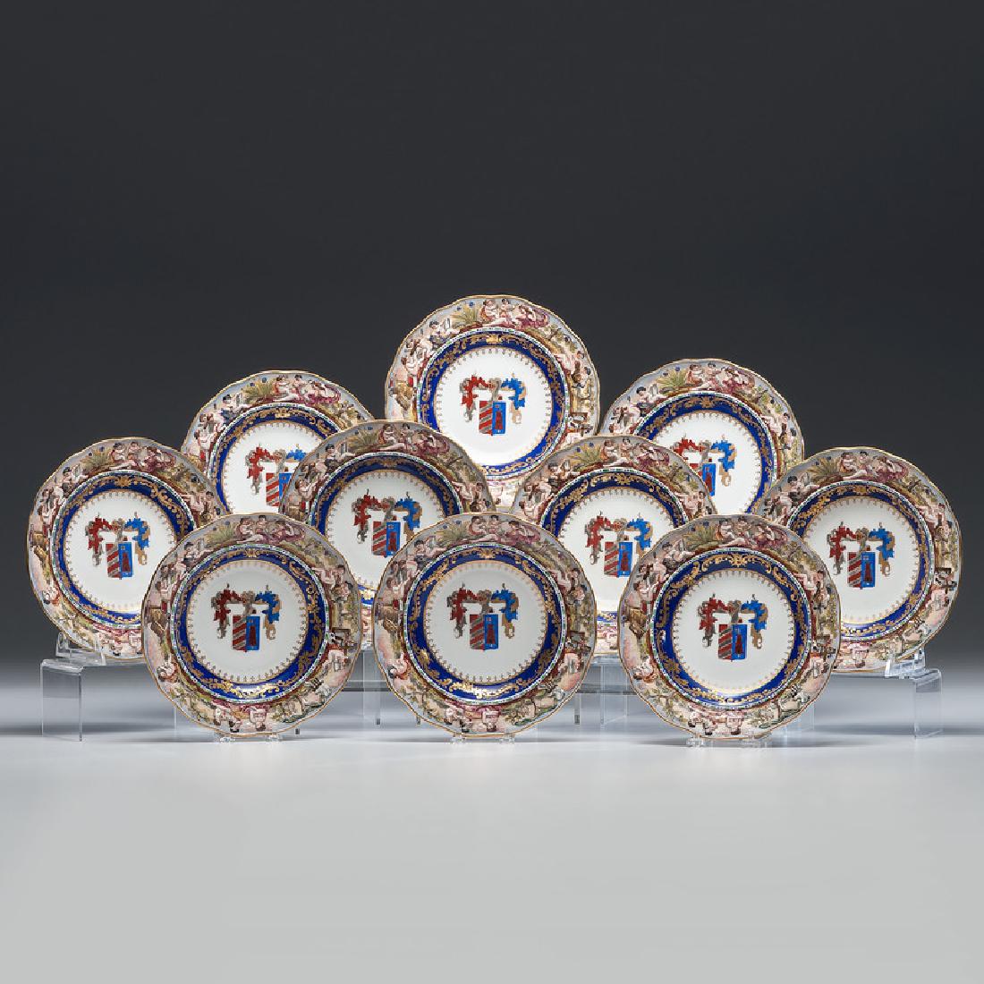 Capodimonte Armorial Cabinet Plates: 20th century. A set of ten cabinet plates, the rims with raised and painted Classical decoration and the centers with matching armorials, each with underglaze blue mark; dia. 9.5 in. (each).