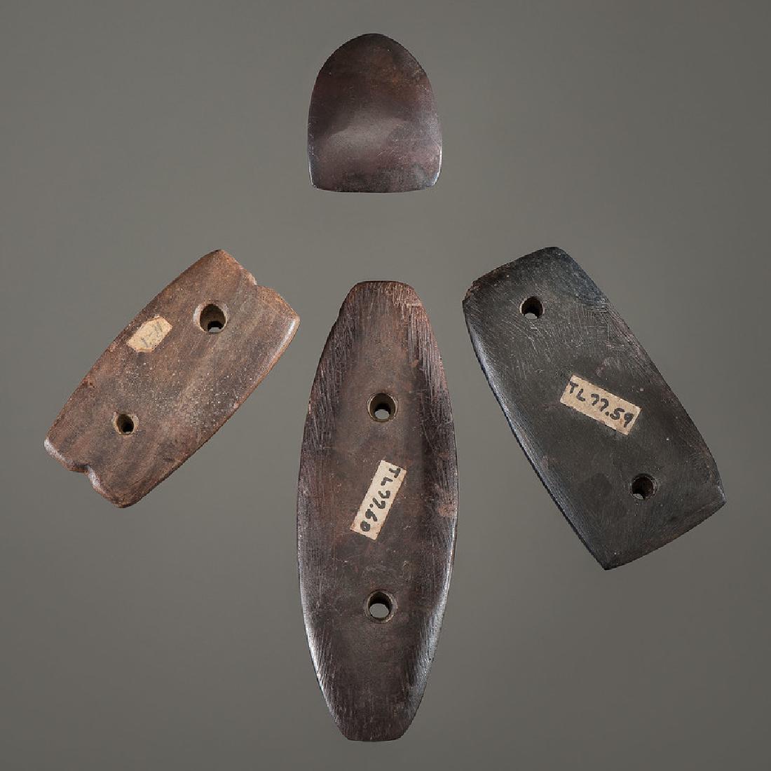 Three Gorgets AND Hematite Celt: Woodland Period, 800 B.C. - A.D. 1200lot of 4, longest 5.25 in.with restoration An interesting group that were apparently collected by the same person, James Shekell.