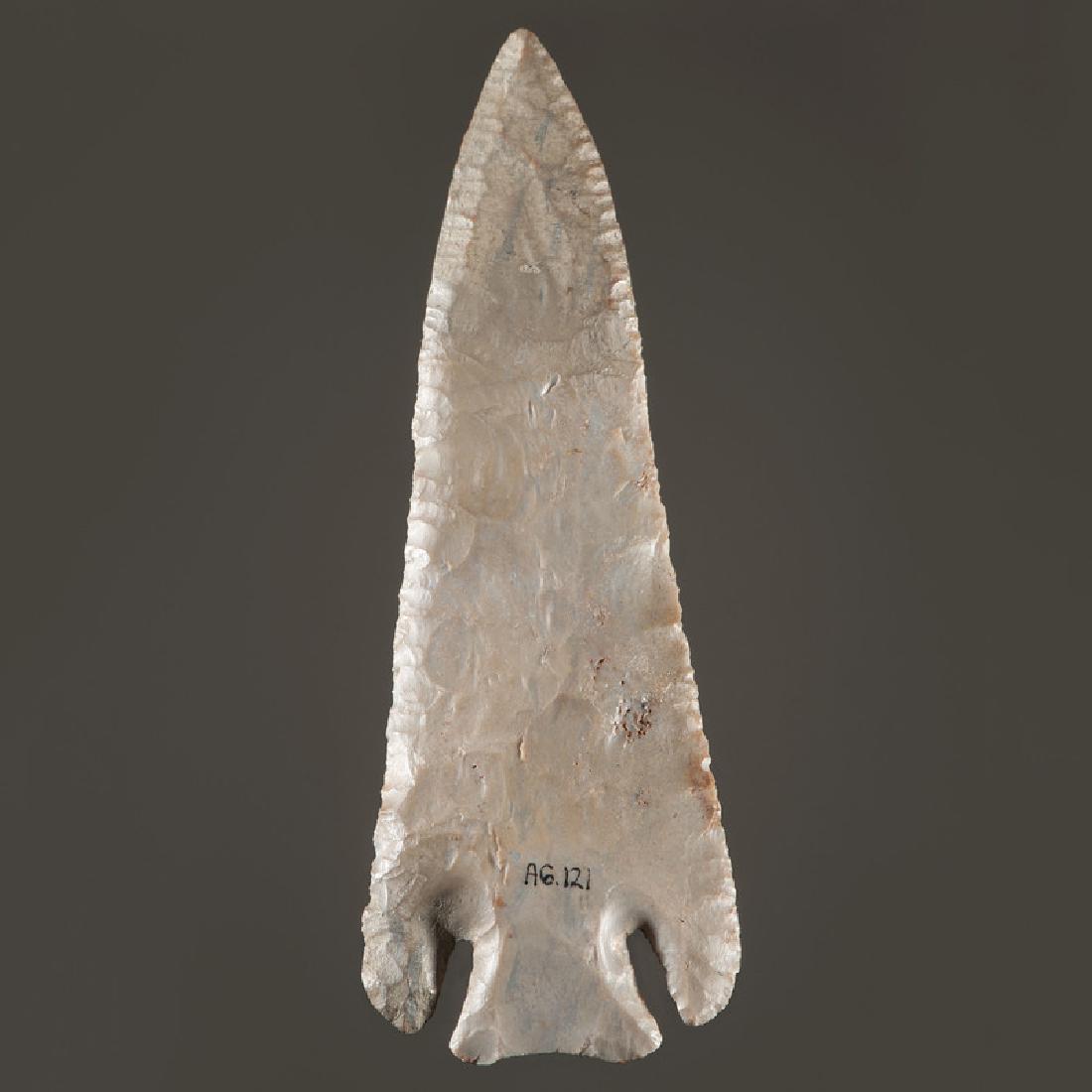 A Large Lost Lake Hornstone Point: Archaic Period, 8000-1000 B.C.length 5.75 in.with restoration Provenance: Publications: Gerber, Art, The Art Gerber Story, 2007, pg. 329, fig. 7.269 Collection History: Art Gerber Catalog Number: AG 1