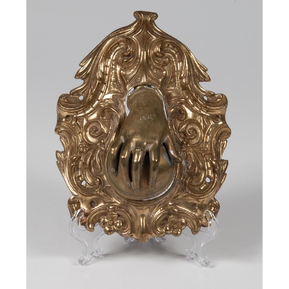 Brass Figural Cue Ball Holder: A brass cue ball holder in the form of a hand; lg. 8.75, wd. 7 in.