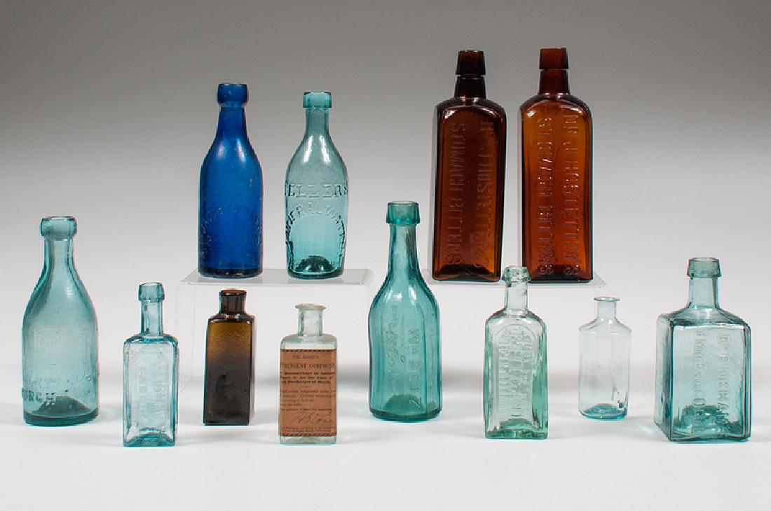 Medicinal and Other Glass Bottles: American, late 19th-early 20th century. A group of twelve glass bottles, including: one medicinal bottle with a label reading DR. ROSE'S ASTRINGENT COMPOUND, For Haemorrhage or Spitting Blood, or for 