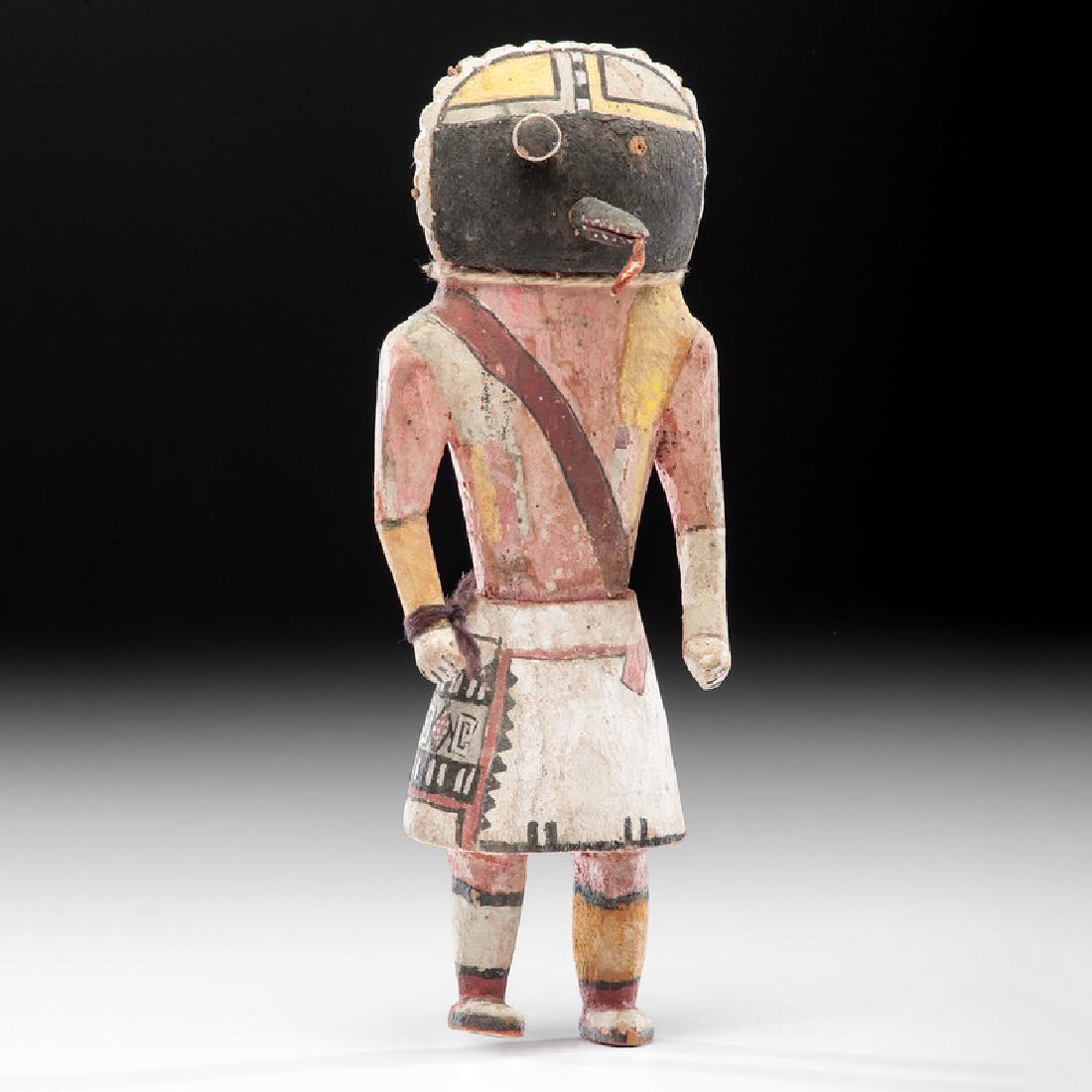 Hopi Wupomo, Long-billed Katsina, From the Collection: brightly painted wooden form featuring a round mask with pop eyes protruding beak-like mouth with tongue hanging out of the front; height 10 in. second quarter 20th century From the Collection of Char