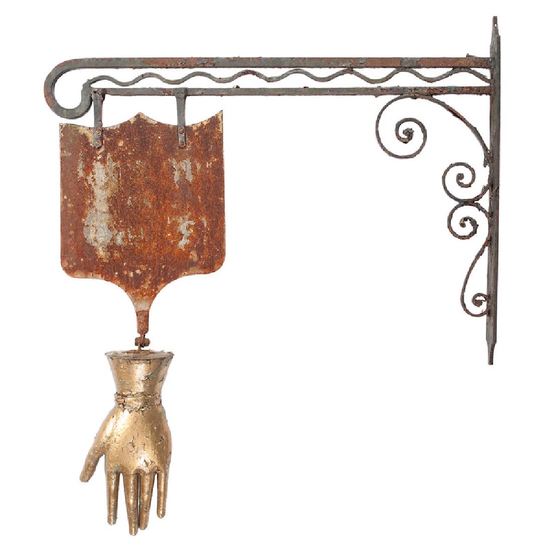 Glove Maker's Trade Sign: 19th century. A large glove maker's trade sign with gilt painted hanging glove and metal sign, suspended from a wrought iron bracket; ht. 51, lg. 47 in. Auctioneer's note: This sign hung outside the G