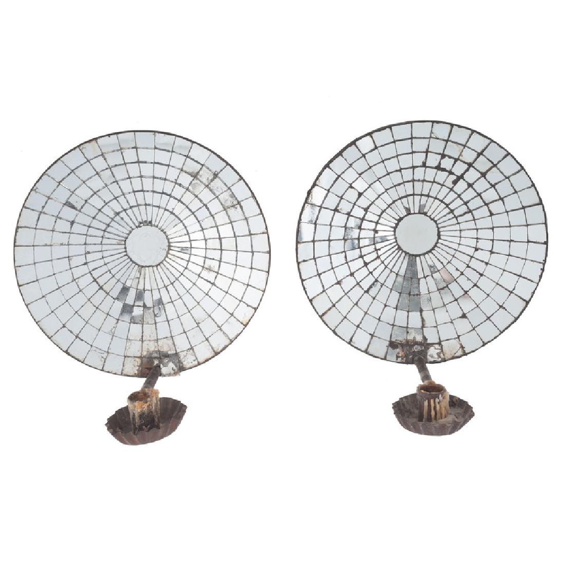 Mirrored Tin Candle Sconces: American, early 19th century. A pair of tin sconces with segmented reflector dishes; dish dia. 10, ht. 11.25 in. (each). Provenance: Property from the Americana Collection of Dr. Dale and Ann Knight G