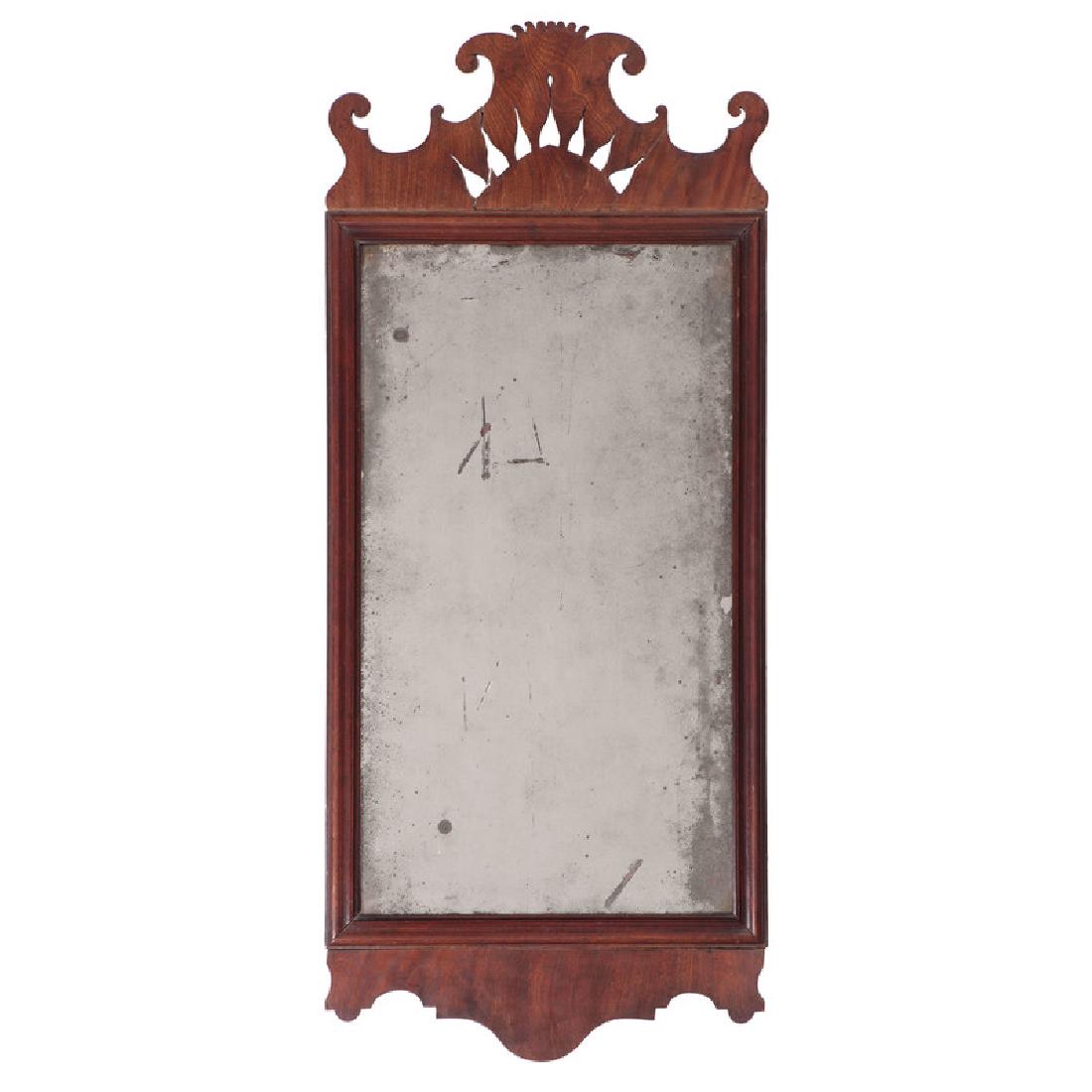 Chippendale Mirror with Cut-Out Crest: American or English, 18th century. A Chippendale mirror in mahogany, the crest with flame cut-out decoration; ht. 36, wd. 15.25 in. Provenance: Property from the Americana Collection of Dr. Dale and A