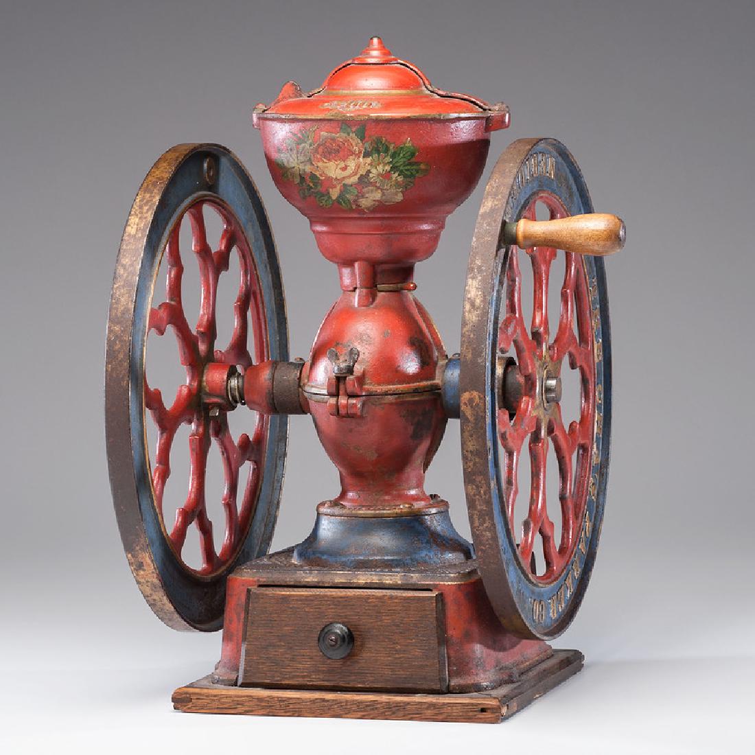 Charles Parker No. 700 Coffee Mill: American, late 19th-early 20th century. A double-wheeled cast iron coffee mill in original paint, with original sliding lid, secured to wood base, embossed The Cha's Parker Co. / Meriden Conn. U.S.A. 