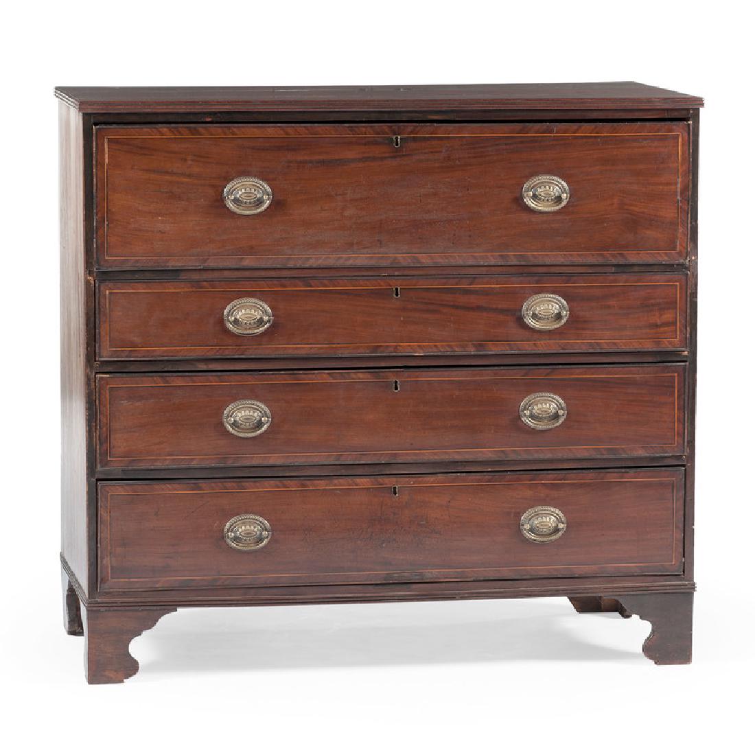 English Chippendale Butler's Chest: English, 19th century. A Chippendale butler's chest in mahogany with banding maple inlay, having a rectangular inlaid and reeded surface, over a pull out leather writing surface, fitted interior desk 