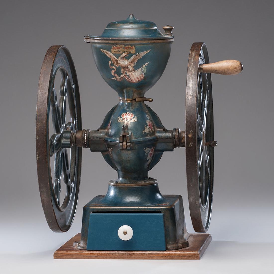 Simmons Hardware Co. No. 15 Koffee Krusher Coffee Mill: American, late 19th-early 20th century. A double-wheeled cast iron coffee mill in original blue paint and decorations, with original hinged lid with wooden pull, secured to wood base, and with newer w