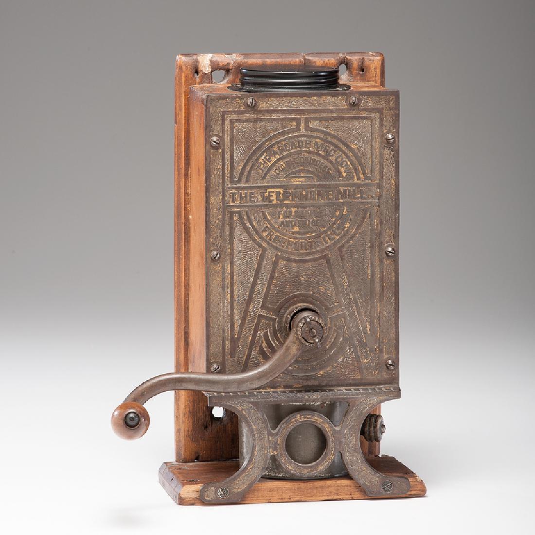 Arcade Telephone Mill with Cast Iron Front: American. An Arcade Telephone Mill, with double grinder for coffee and spices, consisting of a wooden box and cast iron front; ht. 13.25, wd. 7.5, dp. 4.5 in. (not including handle). This model (5-30)
