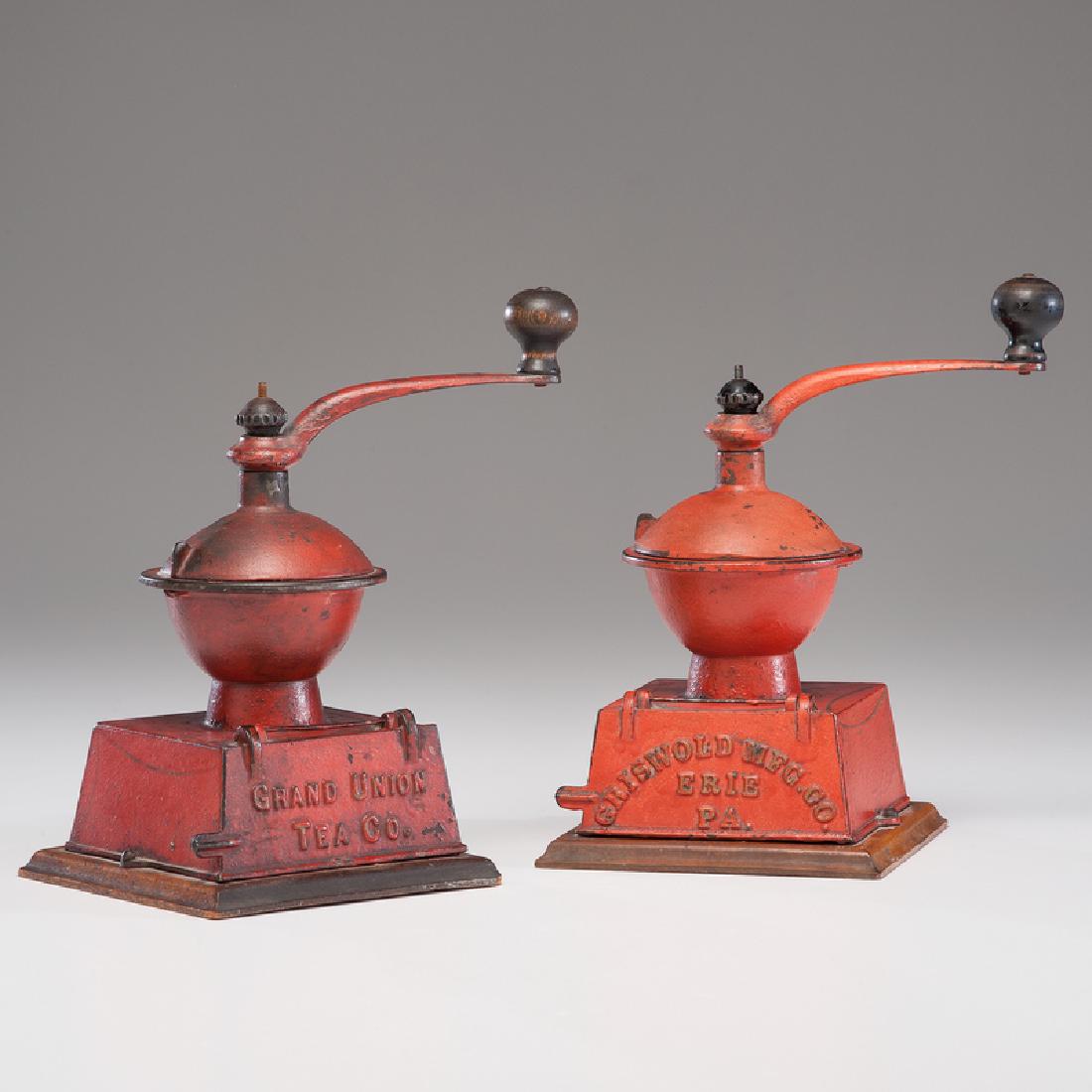 Griswold Red Painted Cast Iron Table Mills: American. Two Griswold cast iron coffee mills in red paint, including a Grand Union model; oah. 10.75, wd. 6.25, dp. 6.75 in. (each, including wooden mounts). These mill models are referenced and pict