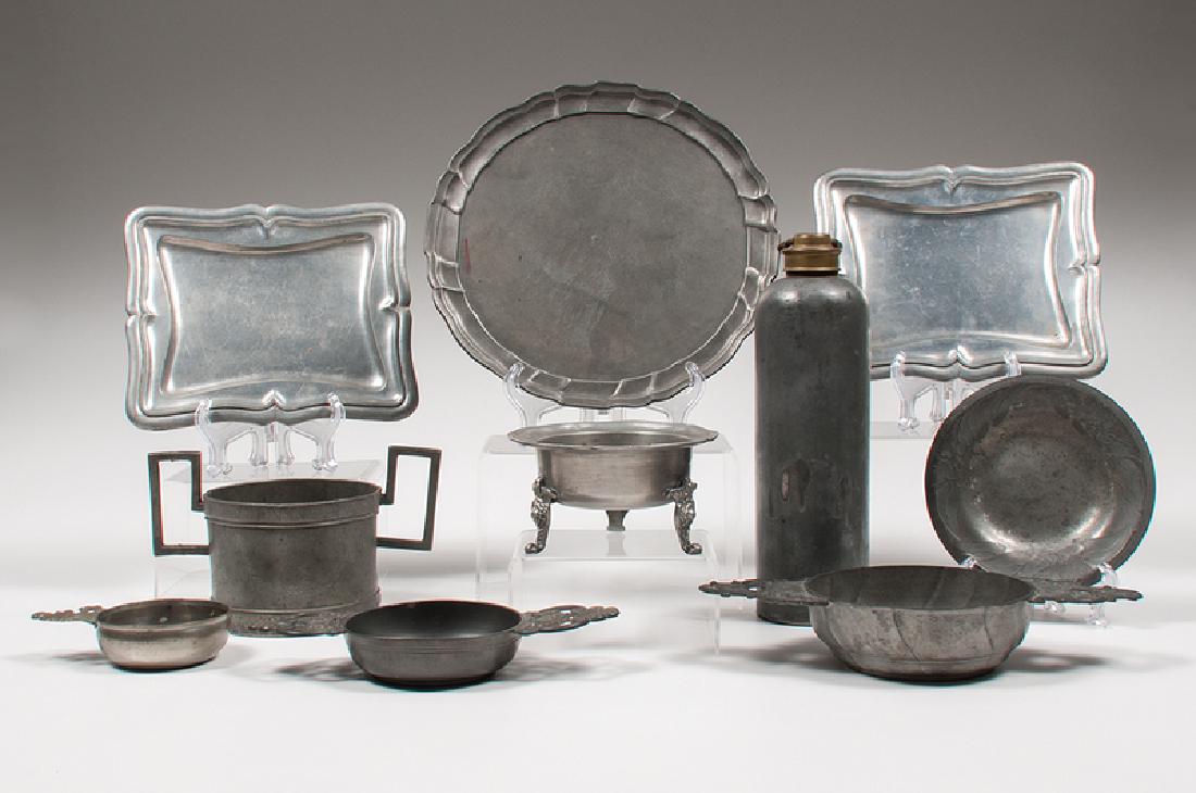 Continental Pewter Wares: Continental, 19th century. A group of ten pewter wares, including a wine coaster, possibly German, a plate impressed with "best quality" angel marks, a three-footed bowl, three porringers, two plates,