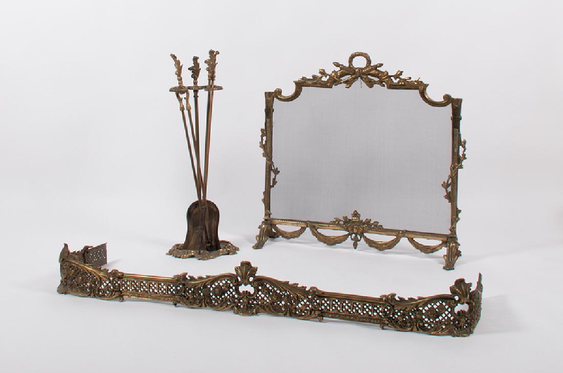 Brass Fireplace Screen and Accessories: American, 19th century. A brass six-piece fireplace set, including a fire guard, fender, and stand with tools; screen ht. 28, wd. 29, dp. 10 in.