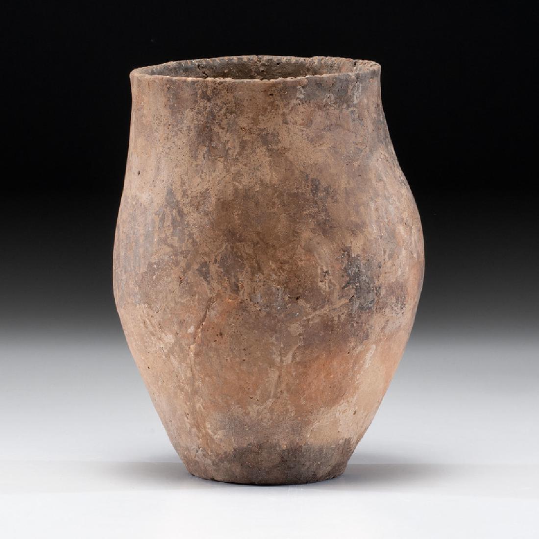 A Hopewell Jar, 9-1/2 x 7 in.: Hopewell Culture, Middle Woodland Period, 200 B.C. - A.D. 400 Expertly restored. height 9-1/2 in. x diameter 7 in. Provenance: Published: Gerber, Art, The Art Gerber Story, 2007, pg. 82, f. 7.022