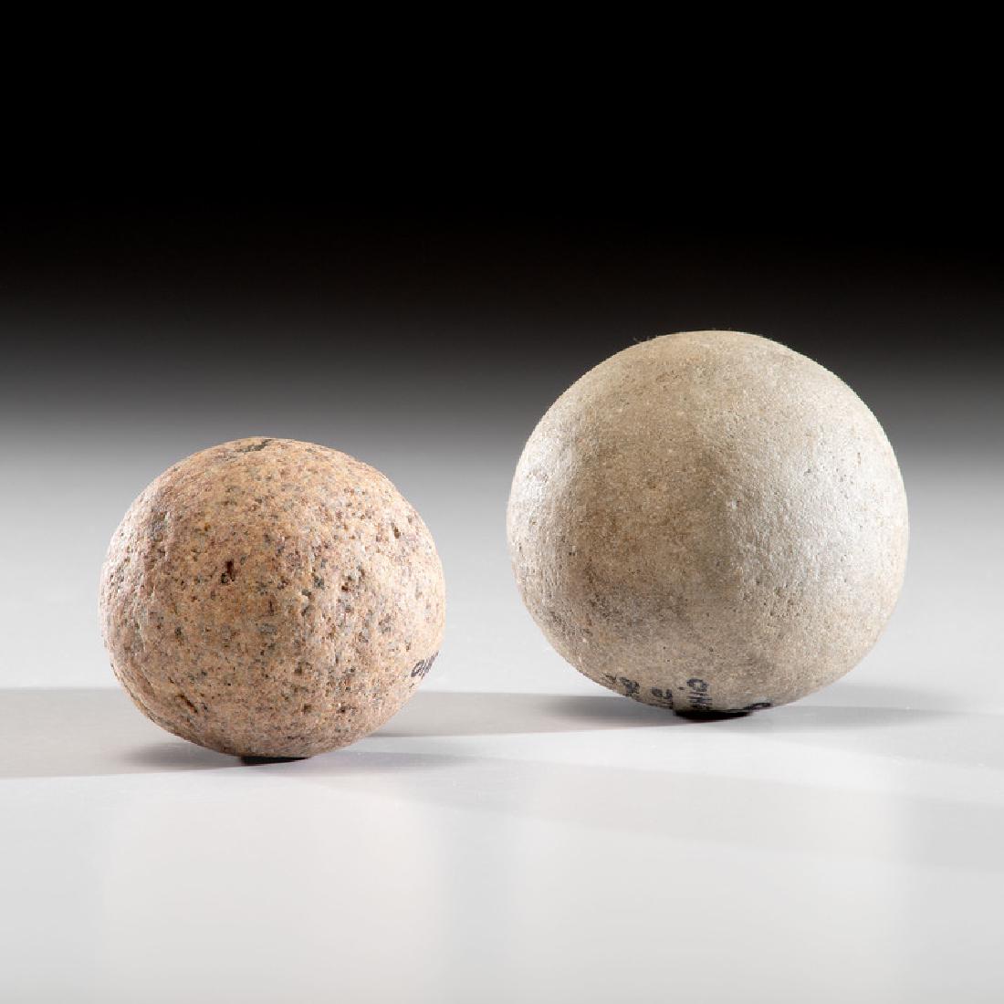 Two Large Game Balls From An Old Collection, Largest 4: Archaic - Middle Woodland Period, 8000 B.C. - A.D. 500 Ross County, Ohio Licking County, Ohio lot of 2, largest diameter 4 in. Provenance: Collection History: From an old collection marked #56 and #57