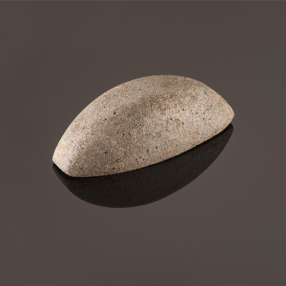 A Granite Imperforated Boatstone, 3-1/4 in.: Late Archaic - Woodland Period, 4000 B.C. - A.D. 1200 length 3-1/4 in. Provenance: Published: Gerber, Art, The Art Gerber Story, 2007, pg. 313, f. 7.253