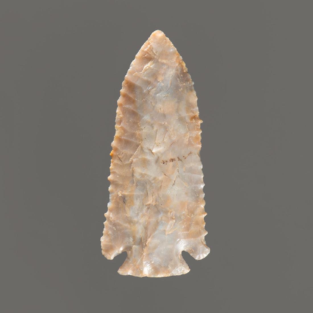 A Corner Notched Point, 3-1/4 in.: Archaic Period, 8000-500 B.C. length 3-1/4 in. Provenance: Collection History: Gerber Collection Number: AG.39 Published: Gerber, Art, The Art Gerber Story, 2007, pg. 369, f. 7.309