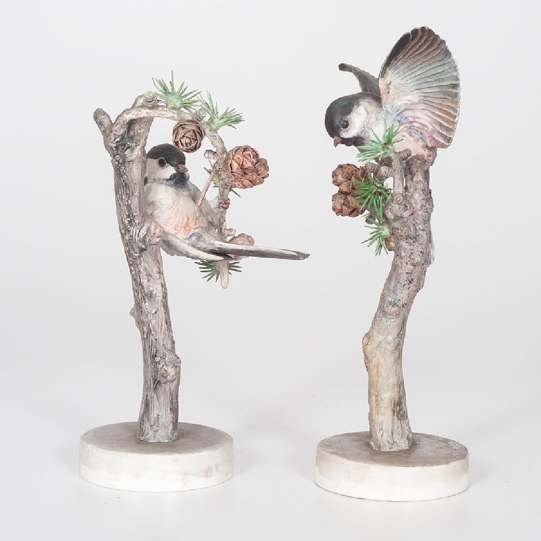 Royal Worcester Dorothy Doughty Chickadee Figures: English, first half 20th century. A pair of porcelain chickadees, male and female, perched on pine branches, modeled by Dorothy Doughty (1892-1962) for her American Birds series, and produced by Royal