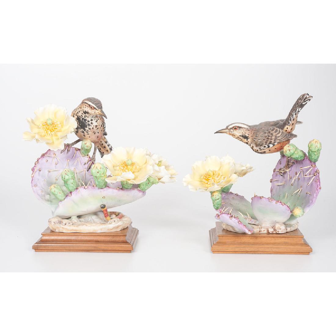 Royal Worcester Dorothy Doughty Cactus Wren Figures: English, first half 20th century. A pair of painted porcelain cactus wrens, male and female, perched on flowering prickly pear plants, modeled by Dorothy Doughty (1892-1962) for her American Birds ser