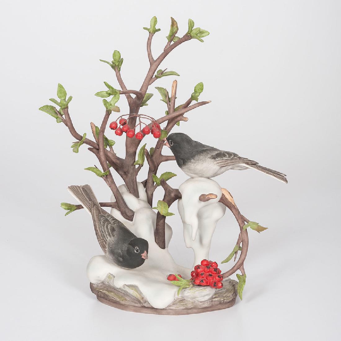 Boehm Junco Porcelain Group: American, 20th century. A painted porcelain Boehm sculpture of two junco birds perched on snow covered berry branches, signed Boehm on base, marked LIMITED EDITION / Edward Marshall Boehm / Junco /