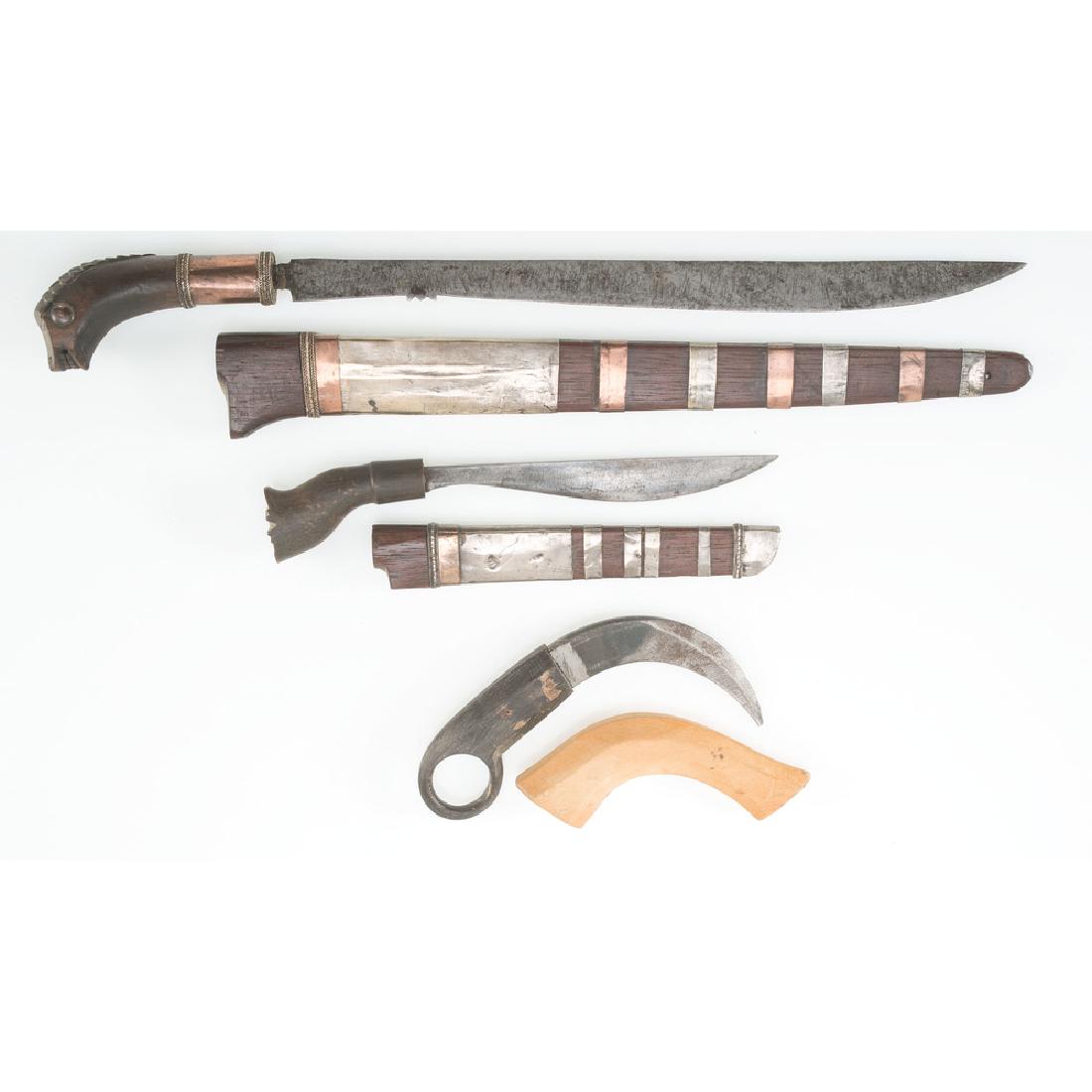 A Group of Indonesian Knives: lot of 3, includes two karo kalasan and one kerambit, longest 14.5 in. late 19th - early 20th century
