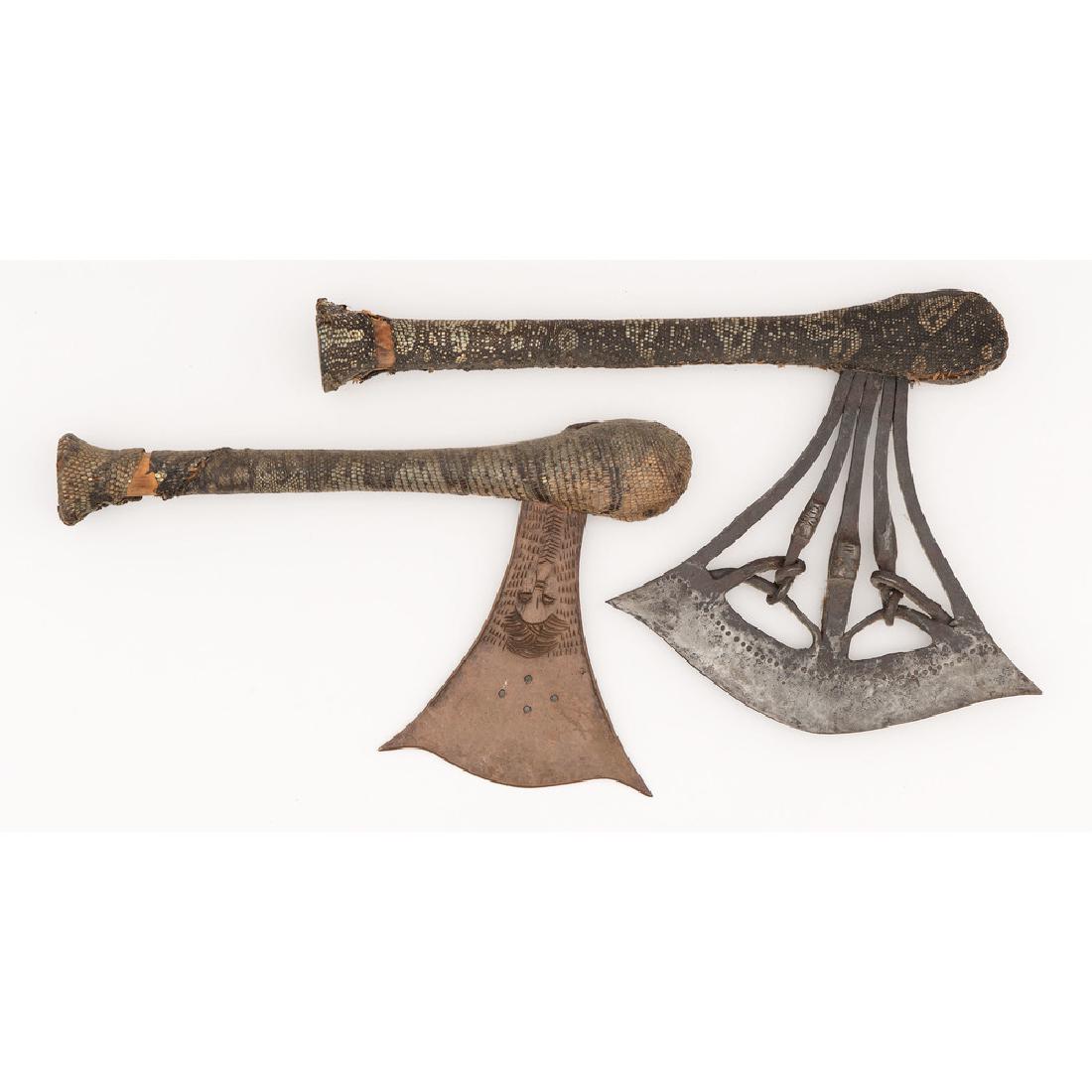 Songye Axes with Reptilian Skin Covered Handles: lot of 2, decorated blades, lengths 15 in. (width of blade 9.75 in.); AND length 13.75 in. (width of blade 6 in.) early 20th century