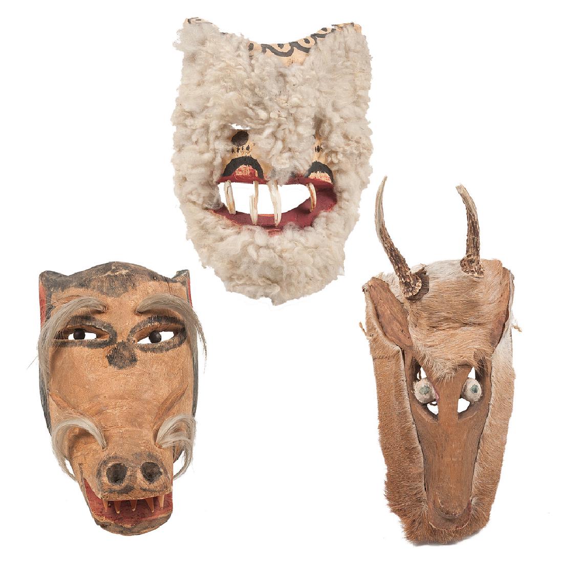 Mexican Hairy Animal Masks, Deaccessioned from the: lot of three, includes a deer mask with real antler and fur, length 15 in. x width 7 in.; PLUS wool mask with real teeth, length 9.5 in. x width 6.25 in.; AND a wolf mask with hair accents, length 10.