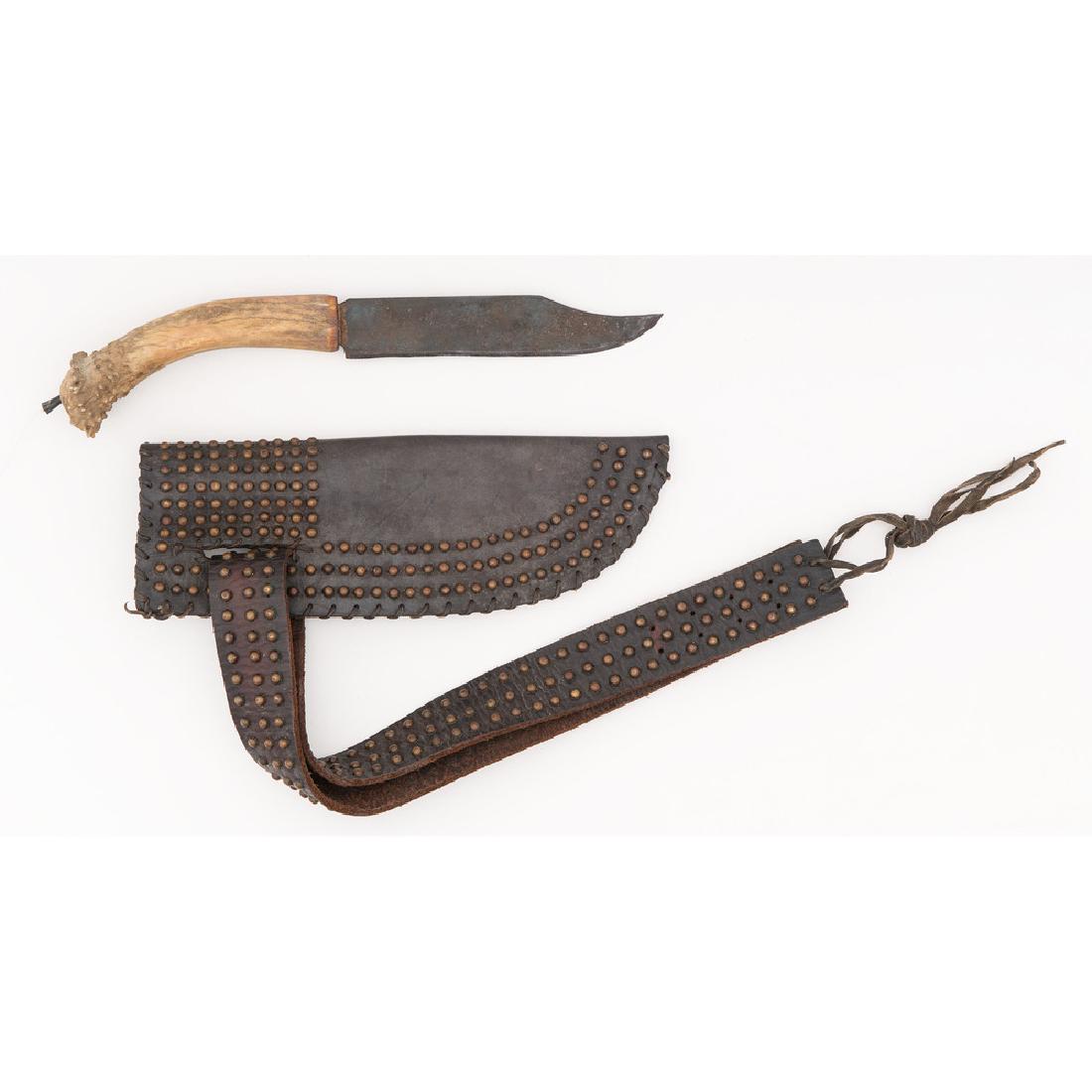 Contemporary Stag Grip Hunting Knife: Blade length 7.5". Contemporary copy of an American Indian style hunting knife with antler grip and leather scabbard with copper tack decoration.